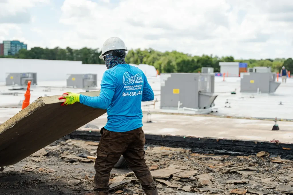 Cox Bros team member working on a commercial roofing project