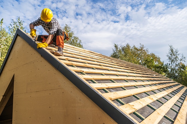 Professional roofer in a hard hat at a South Carolina roofing job